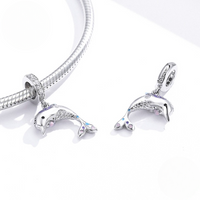 Intricately detailed dolphin charm in sterling silver