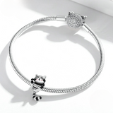 Raccoon charm - the perfect addition to your silver jewelry collection